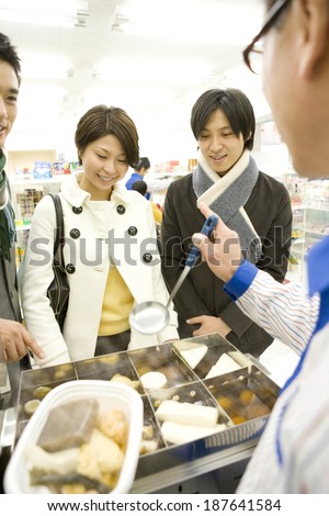 man and woman buying Japanese pot-au-feu at convenience store