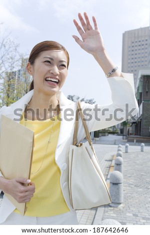 business woman raising hand with smile