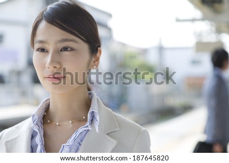 business woman smiling on the platform