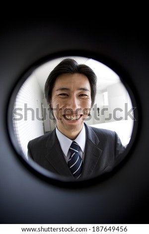 sales person seen through peep window
