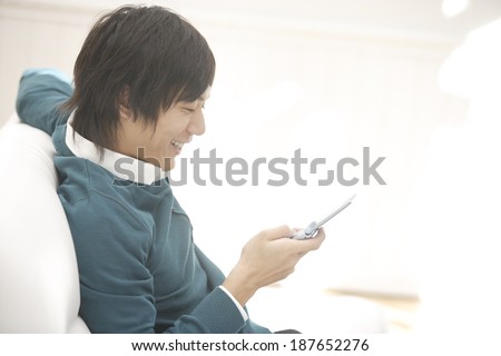 man looking at mobile phone