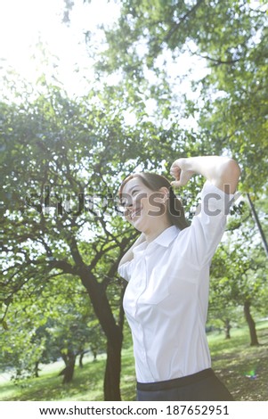 woman standing on tiptoe in greenery