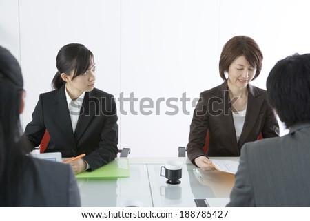 man and woman in meeting