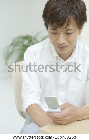 man looking at mobile phone