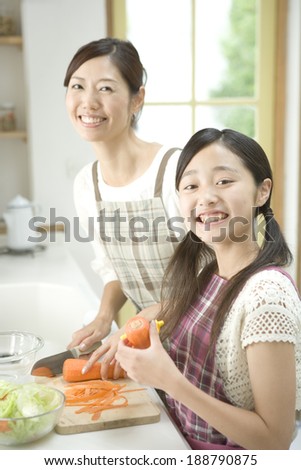 mother and daughter cooking