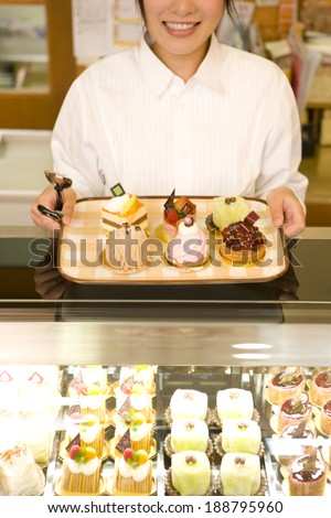 Female staff in cake shop