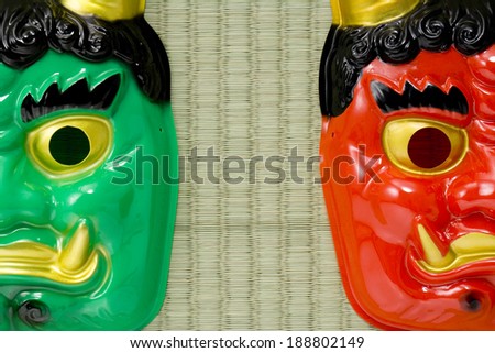 Masks of a red devil and a blue devil