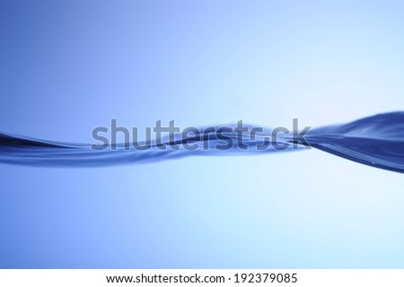 A dark blue wave against a light blue background.