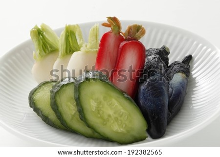 Four types of food placed in a serving dish.