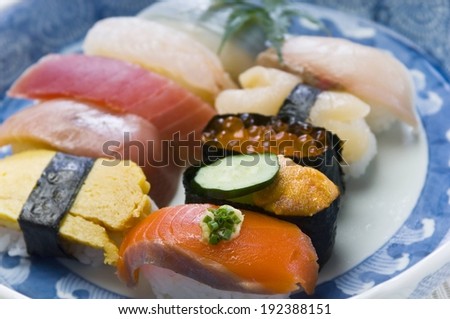 A vast amount of raw fish on a dinner plate.