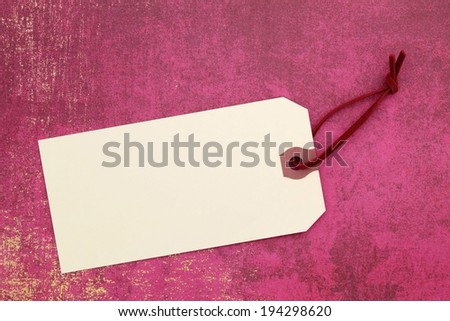 A blank gift card with a red string.