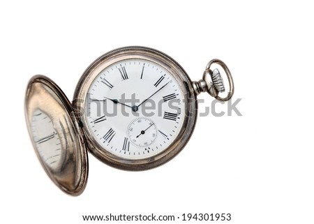 A pocket watch showing the time as twelve minutes after ten.