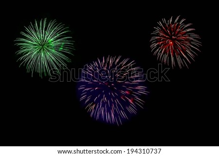 Three separate displays of fireworks set against a black background.