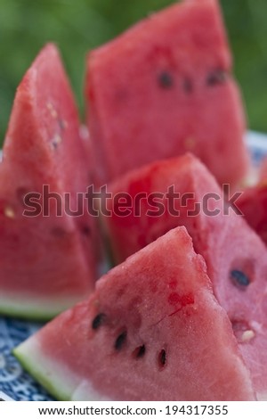 Some pieces of watermelon with their black seeds.