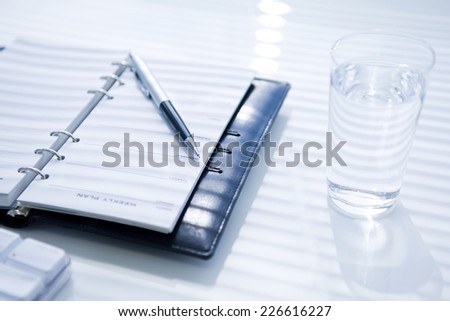 Notebook and pen placed on a desk