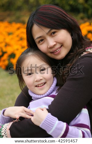 portrait of mother and 8-year old daughter, shanghai, china