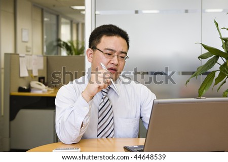 young asian business executive working in office