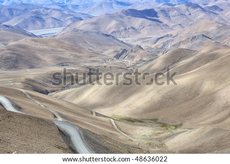 tibet: winding road through the mountains of tibetan plateau; HDR image.