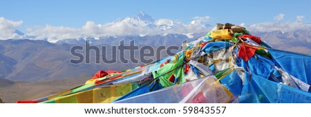 tibetan prayer flags with mount everest in the background, tibet.