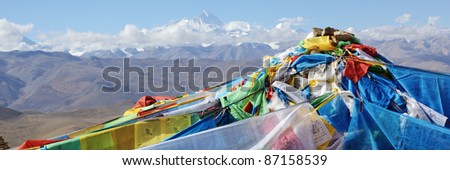 tibet: prayer flags with mount everest in the background