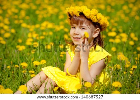 Beautiful girl with dandelion in hand