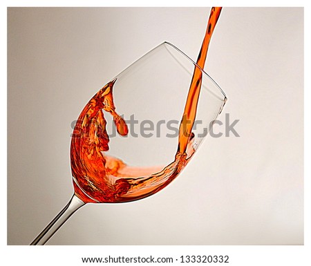 Translucent Wine/Liquid pour splash with off white background
