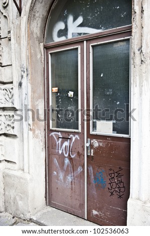 Graffiti tagged all along an abandoned building.