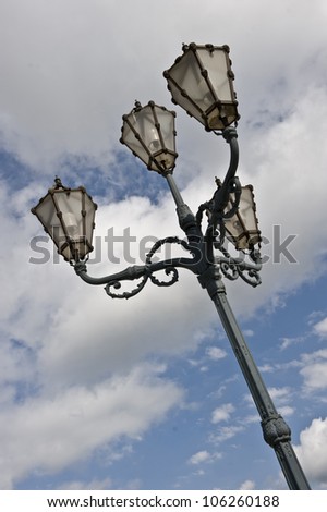An angular shot of a light post in Austria
