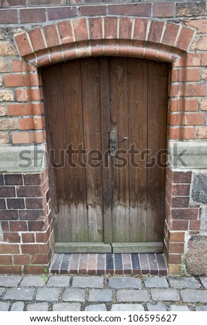 A daytime shot of the side door to the Church of St. Nicholas.