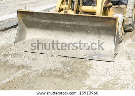 Closeup of a yellow bulldozer scoop
