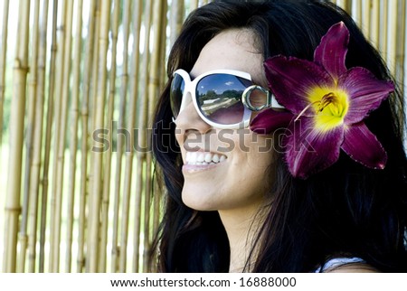 Pretty brunette woman laughing while looking away from camera