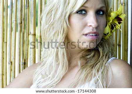 Photo of blonde woman facing camera with serious facial expression