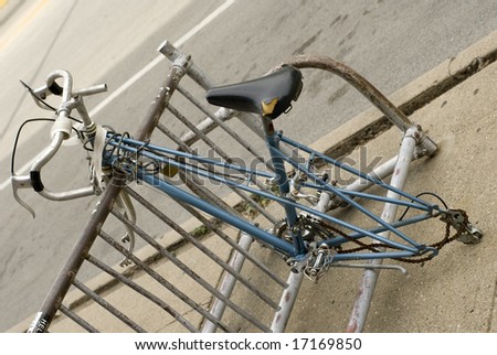 Blue bike locked to bicycle rack