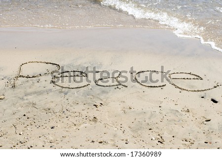 Peace written on the beach on a sunny day at Lake Michigan.