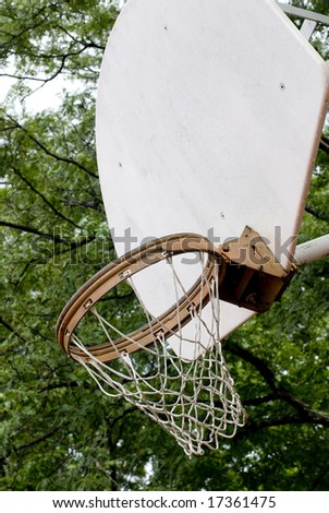 Worn basketball net and rim attached to a white backboard