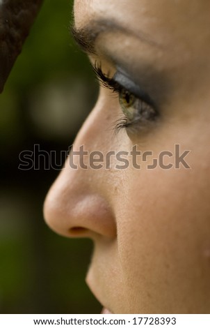 Side angle view of a pretty model\'s face on a bright day