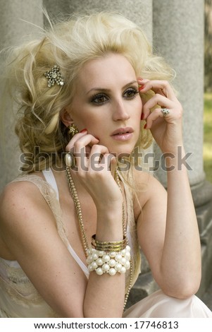 Blonde model with big hair and a rhinestone hair clip