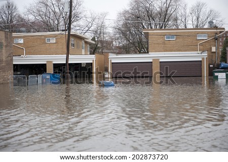 Flooded homes in the Chicago area on a cloudy day.