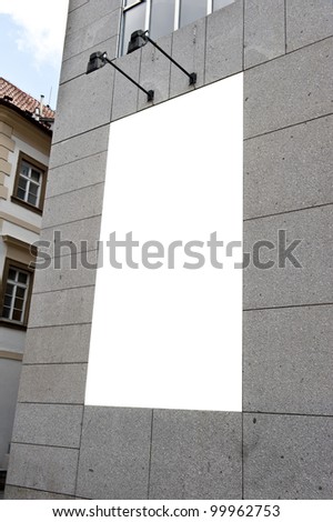 White block in a gray concrete wall that looks like empty ad space.