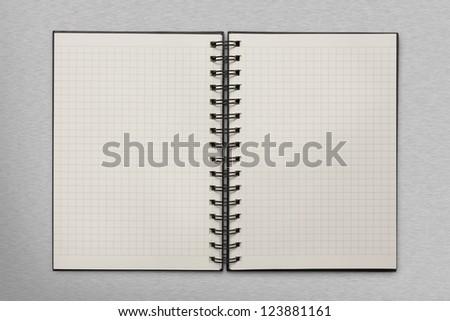 checked notepad on metal background