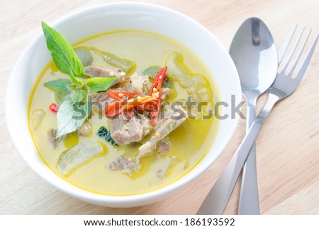 Green curry with pork   and fork spoon