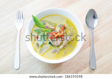 Green curry with pork   and fork spoon