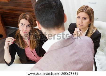 Female office employees caught by manager at inappropriate social networking during working hours. Boss is criticizing them.