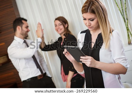 Beautiful business woman with tablet, team work, business meeting, successful idea. Business office.
