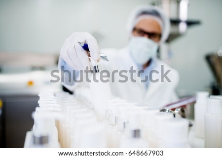 Healthcare industry. Creme production. Working in laboratory with special equipment.