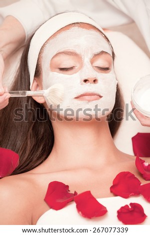 Healthy Spa: Young Natural Relaxing Beauty Having Moistening Mask Applied