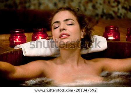 Healthy Spa: Young Beautiful Relaxing Woman Sitting in the Japanese Phyto Barrel and Having Spa Treatment