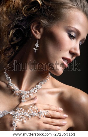 Close-up: Portrait of the Beautiful Bride with jewelries
