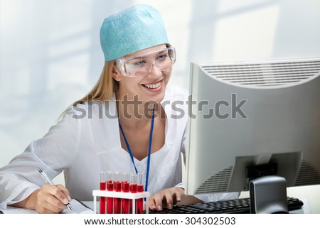 Young Woman Scientist Working in Laboratory blood studies