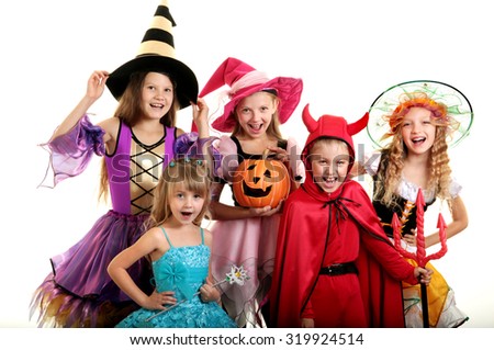 Five Happy Children in Halloween Costumes of Witches, Demon and Princess.